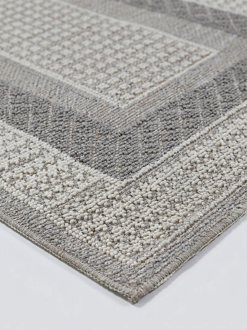 Waschbarer Kurzflor-Teppich Bordüre · 100 % recyceltes Polyester · Maschinell gewebt · Hellgrau meliert
