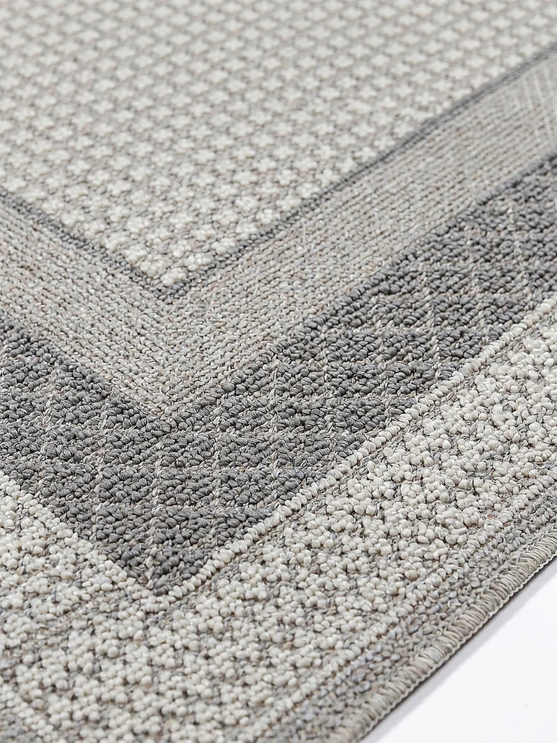 Waschbarer Kurzflor-Teppich Bordüre · 100 % recyceltes Polyester · Maschinell gewebt · Hellgrau meliert