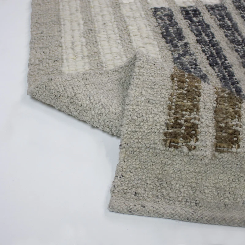 Bouclé-Teppich Blockmuster · 58 % Wolle · flach strukturiert