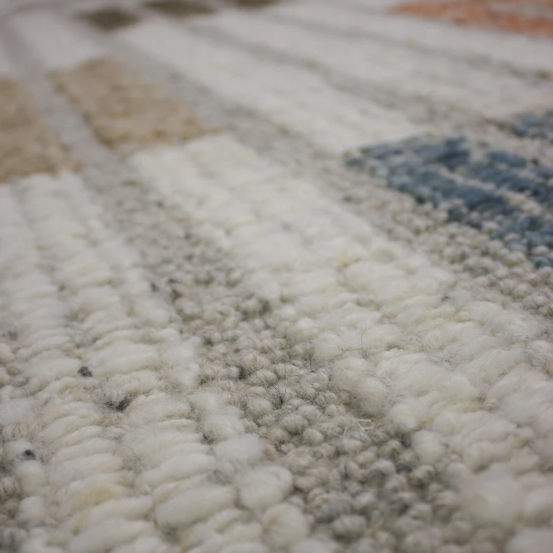 Bouclé-Teppich Blockmuster · 58 % Wolle · flach strukturiert