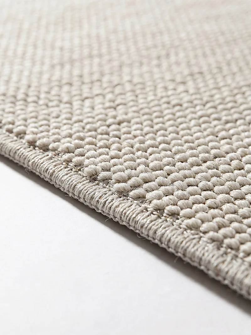 Waschbarer Flachgewebe-Teppich · Bouclé-Look · 100 % recyceltes Polyester · Hellgrau