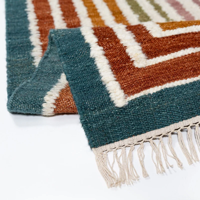 Flachgewebe-Teppich Bouclé-Frame · 74 % Wollanteil · handgewebt mit Fransen