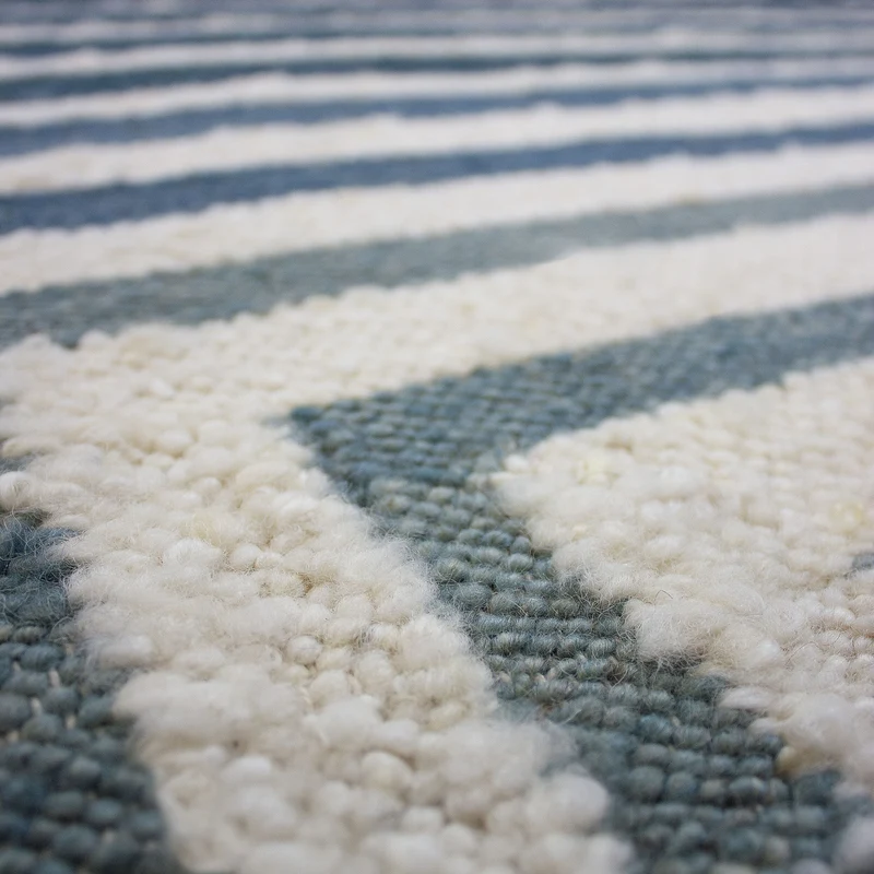 Flachgewebe-Teppich Bouclé-Frame · 74 % Wollanteil · handgewebt mit Fransen