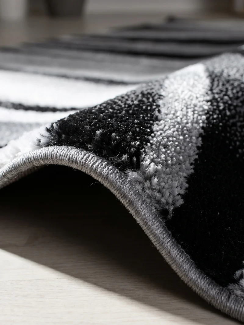 Kurzflor-Teppich Schwunglinien – Waschbar | Dynamisches Wellendesign | Heatset-Veredelung für Wolloptik