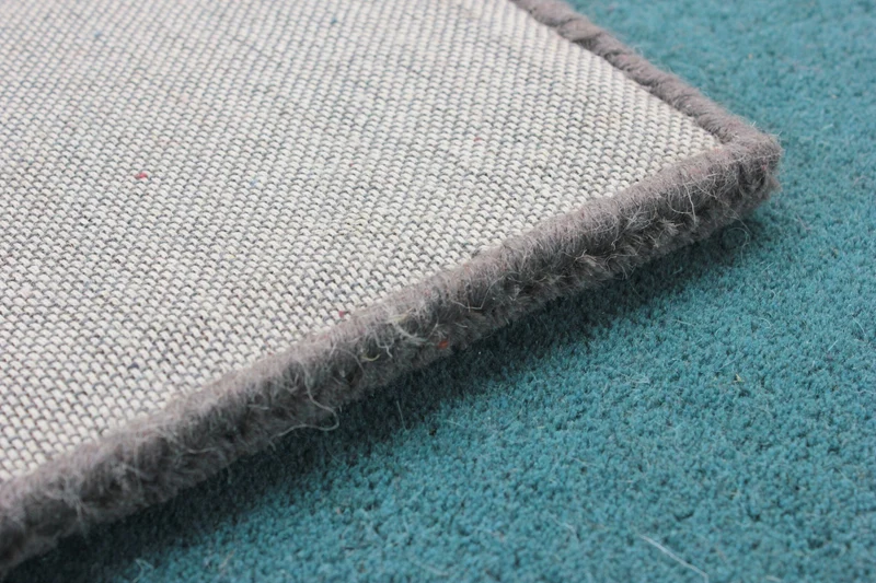 Wollteppich Cut-Out-Geometrie · 100 % Wolle · 10 mm Kurzflor
