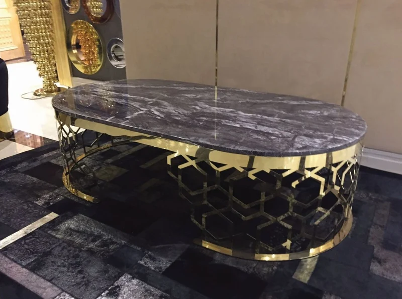 Casa Padrino Luxus Couchtisch mit Kunstmarmor Tischplatte Grau-Schwarz / Gold 140 cm