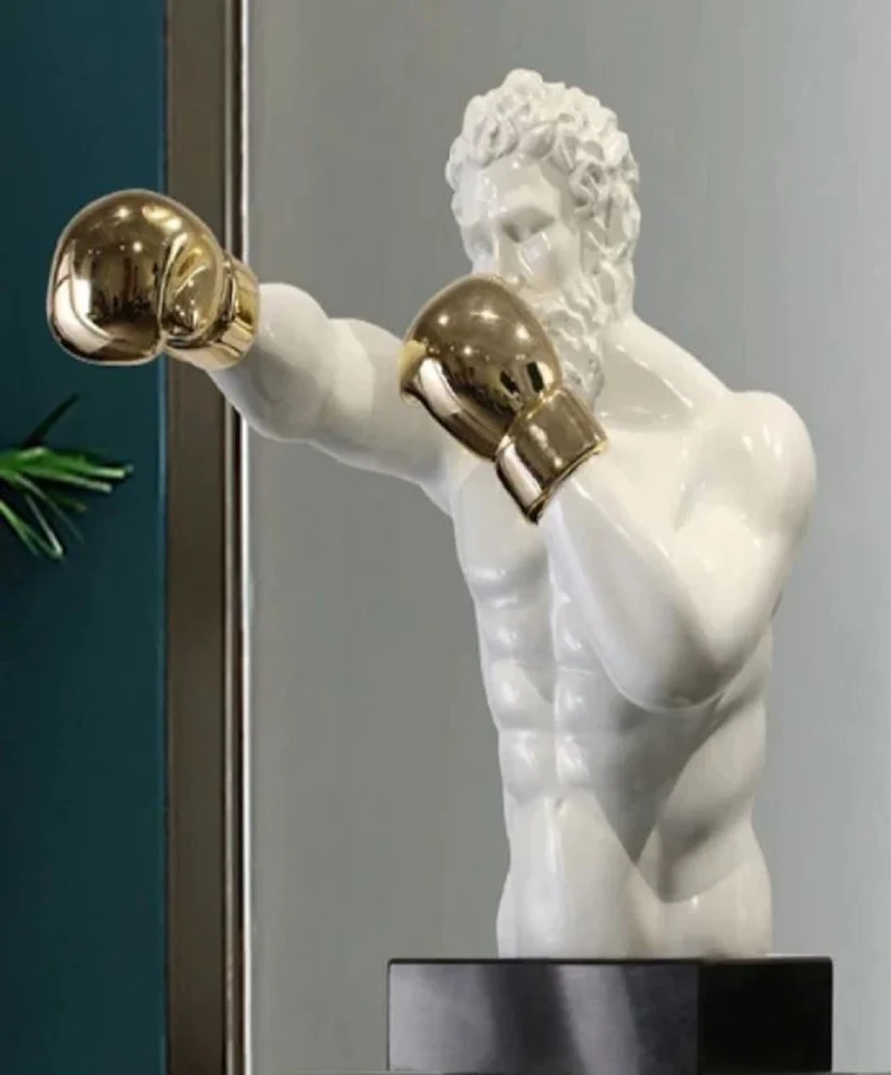 Casa Padrino Luxus Designer Deko Skulptur Boxer Weiß / Gold / Schwarz 31 x 52 x H. 56 cm - Kunstharz Deko Figur mit Sockel - Wohnzimmer Deko - Luxus Designer Deko Accessoires - Luxus Qualität