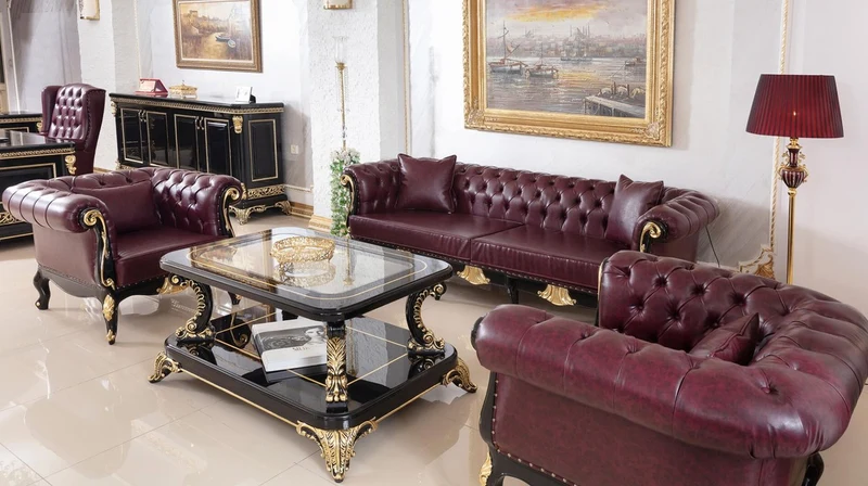 Casa Padrino Luxus Barock Chesterfield Sessel Bordeauxrot / Schwarz / Gold - Prunkvoller Wohnzimmer Sessel mit edlem Kunstleder - Barock Chesterfield Wohnzimmer Möbel