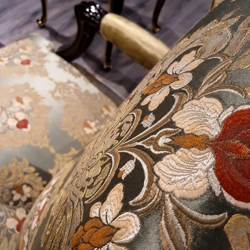 Casa Padrino Luxus Barock Ohrensessel Gold / Mehrfarbig / Schwarz - Prunkvoller Wohnzimmer Sessel mit elegantem Muster - Barock Möbel