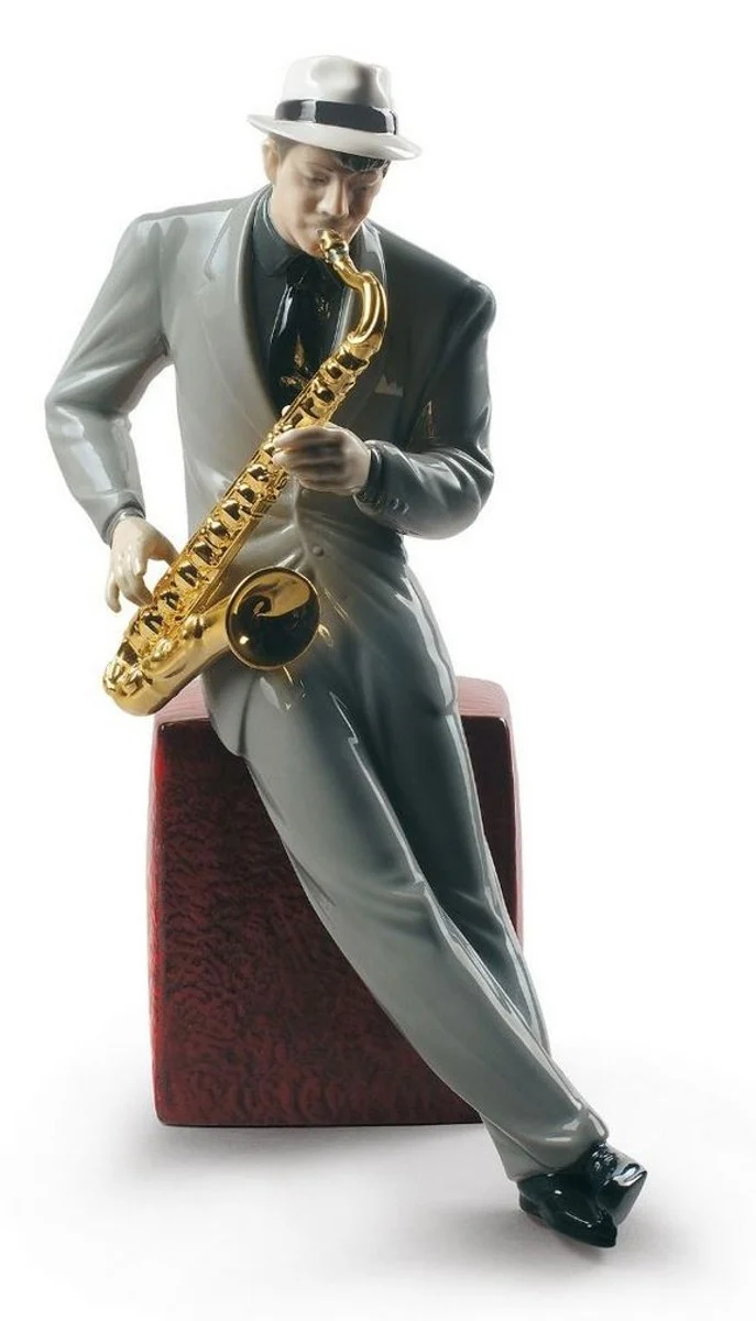 Casa Padrino Porzellan Skulptur Jazz Saxophonist, mehrfarbig, 23 x H. 29 cm - Handgefertigte & Handbemalte Luxus Deko Figur